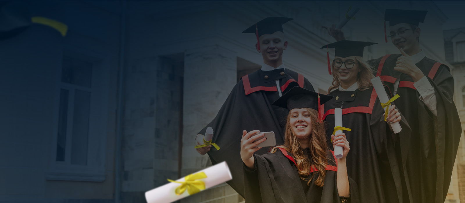 Graduates celebrating with their diplomas